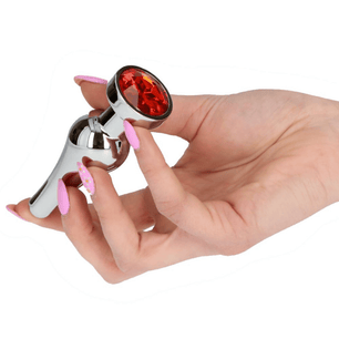 Plug anale in metallo lucido con grande cristallo rosso sfaccettato