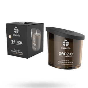 Candela da massaggio Swede Senze Euphoria vaniglia e sandalo con confezione nera e contenitore in vetro ambrato con coperchio nero.